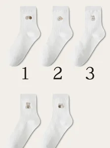 Japanese style white cotton mid-calf socks with cute embroidered patterns, soft and breathable.