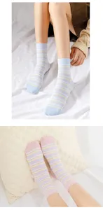 Close-up detail shot of striped mid-tube cotton socks, displaying pastel colors and soft texture.