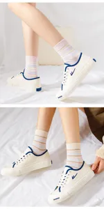 Striped mid-tube casual socks for women, breathable cotton athletic socks for daily wear.