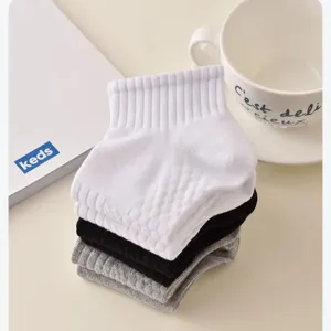 Breathable solid color short socks for men, comfortable cotton honeycomb athletic footwear accessory.