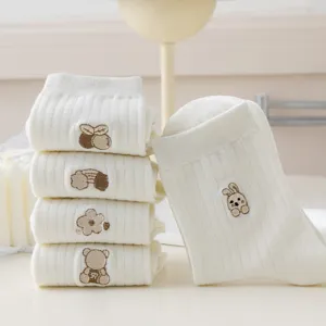Cute white mid-tube cotton socks featuring sweet brown bear and flower embroidery designs.