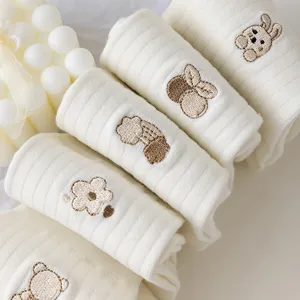 Cute embroidered white ribbed mid-calf socks for women, sweet Japanese style cotton hosiery.