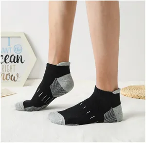 Detail view of men athletic ankle socks with breathable mesh and pull tab design.