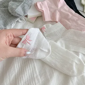 Detail view of women breathable mesh short socks featuring cute bow embroidery for spring and summer.