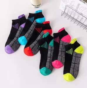 Detailed view of breathable athletic ankle socks with colorful toe and heel blocks for men.