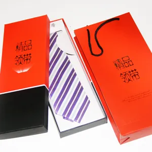 Men's striped tie set with elegant gift box and matching red bag, perfect for business wear.