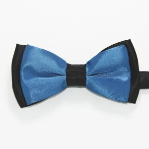 Detalle de pajarita azul y negra brillante, tela de poliéster de doble capa para bodas y fiestas.