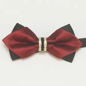 Close-up of double-layered red and black bow tie with crystal rhinestone center knot.