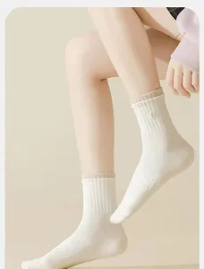 Women's cotton crew socks with ribbed cuffs, breathable, comfortable, casual sports daily wear.