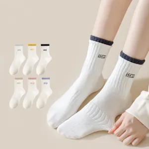 Women's mid-tube cotton socks with double ribbed cuffs, breathable and comfortable everyday wear.