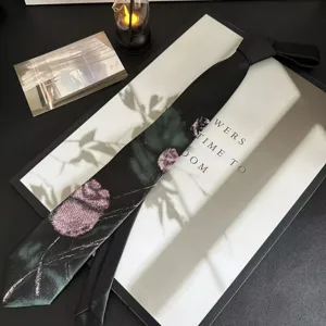 Y2K aesthetic black tie with pink rose floral pattern, stylish casual neckwear accessory.