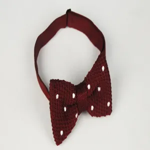 Burgundy knit bow tie with white polka dots, textured fabric, adjustable strap for men.