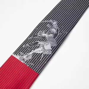 Detailed view of the Y2K anime graphic necktie featuring black white stripes and red accent.