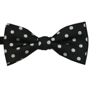 Detailed view of classic black bow tie featuring elegant white polka dots for children.
