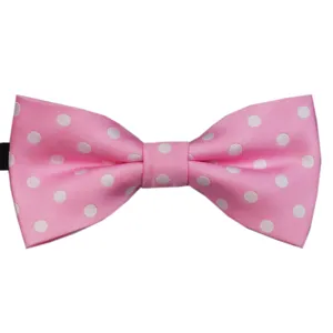 Close-up detail of the pink polka dot bow tie showing texture and fabric craftsmanship.