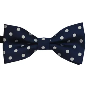 Detailed product shot of a classic navy blue bow tie with elegant white polka dots.