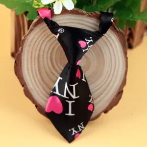 Black satin kids pets necktie with pink heart I NY print main view showcasing product design details.