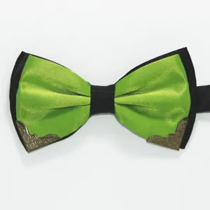 Close-up of a stylish two-tone green black bow tie featuring ornate bronze metal corners.