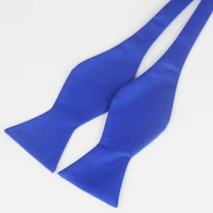 Blue polyester self-tie bow tie detail close-up, classic solid color formal menswear accessory.