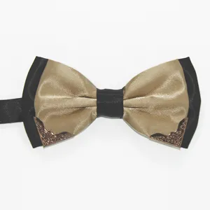 Detail shot of a black and gold double layer men bow tie with metal corner decor.