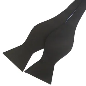 Black solid color self-tie bow tie for men, classic formal wear gourd bowtie accessory.