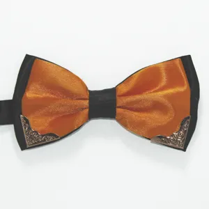 Close-up detail shot of the elegant men's two-tone bow tie with metallic corner decor.