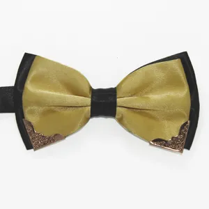 Closeup of a stylish mens black and gold bow tie featuring exquisite metallic decorative corner tips.