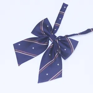 Dark blue JK uniform bow tie with white stars and stripes pattern, elegant women neck accessory.