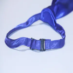 Blue satin pre-tied tie detail showing adjustable hook clasp mechanism and smooth fabric texture.