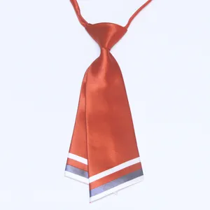 Detail view of a Korean style rust orange double layer knife shape necktie with striped trim.