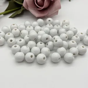 White ceramic beads detail shot, smooth round loose beads for DIY handmade jewelry bracelets.