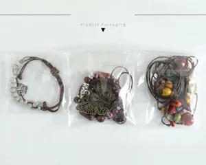 Three pieces of ceramic beaded bracelets packed in clear plastic bags for shipping
