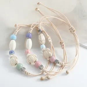 Chic ceramic turtle braided bracelet featuring colorful beads and adjustable rope.