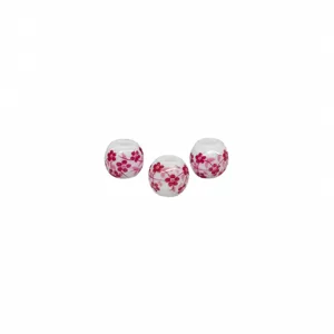 White ceramic beads with pink floral decal for DIY jewelry making and accessories.