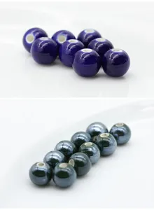 Detailed view of glossy ceramic round beads, perfect for DIY jewelry making and bracelets.
