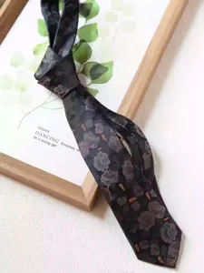 Vintage dark floral necktie detail, 8cm wide classic design for business and formal wear.