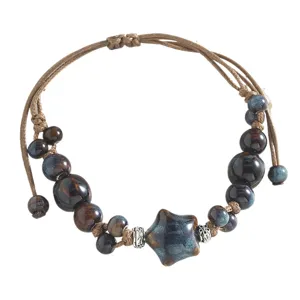 Handmade blue ceramic beaded bracelet with star charm, retro woven cord adjustable design.