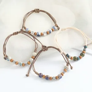 Retro handmade braided bracelet with ceramic wood beads, adjustable boho jewelry for men.