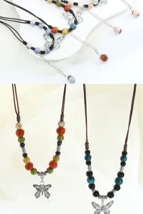 Close-up details of New Chinese style ceramic butterfly pendant necklace with colorful beads.