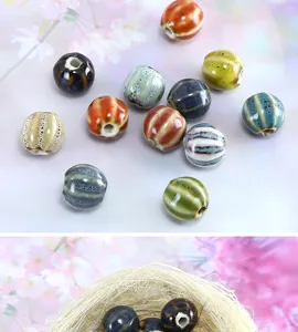 Close up detail view of colorful glazed ceramic watermelon beads, ideal for DIY jewelry.