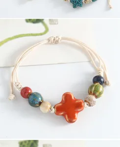 Handcrafted Jingdezhen ceramic beaded bracelet with colorful charms and woven cord.