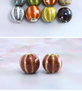Close-up detail of vintage glazed ceramic watermelon beads for DIY jewelry making and bracelets.