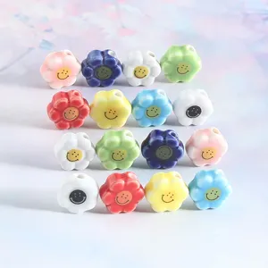 Colorful ceramic daisy flower beads with cute smiley faces, perfect for DIY handmade jewelry.