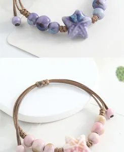 Handmade ceramic starfish bracelet detail close-up showcasing unique braided rope and beads.