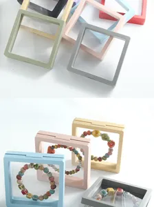 Transparent PE film floating jewelry box detail showing multi-color square display cases.
