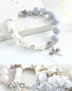 Close-up detail view of the ceramic and crackle stone beaded bracelet with dragonfly charm.
