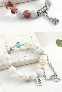 Nuovo braccialetto di perle in ceramica cinese con ciondoli, gioiello versatile per donne.