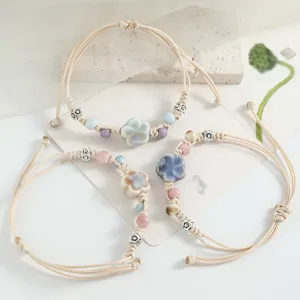 Handmade ceramic flower beaded braided rope bracelet, literary Mori style casual fashion jewelry.
