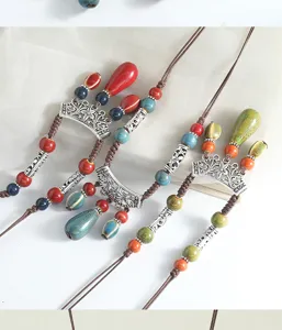 Bohemian style ceramic water drop long necklace retro sweater chain detailed accessory view.