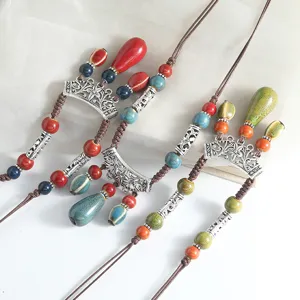 Bohemian long ceramic necklace with colorful drop pendants and vintage silver elements.